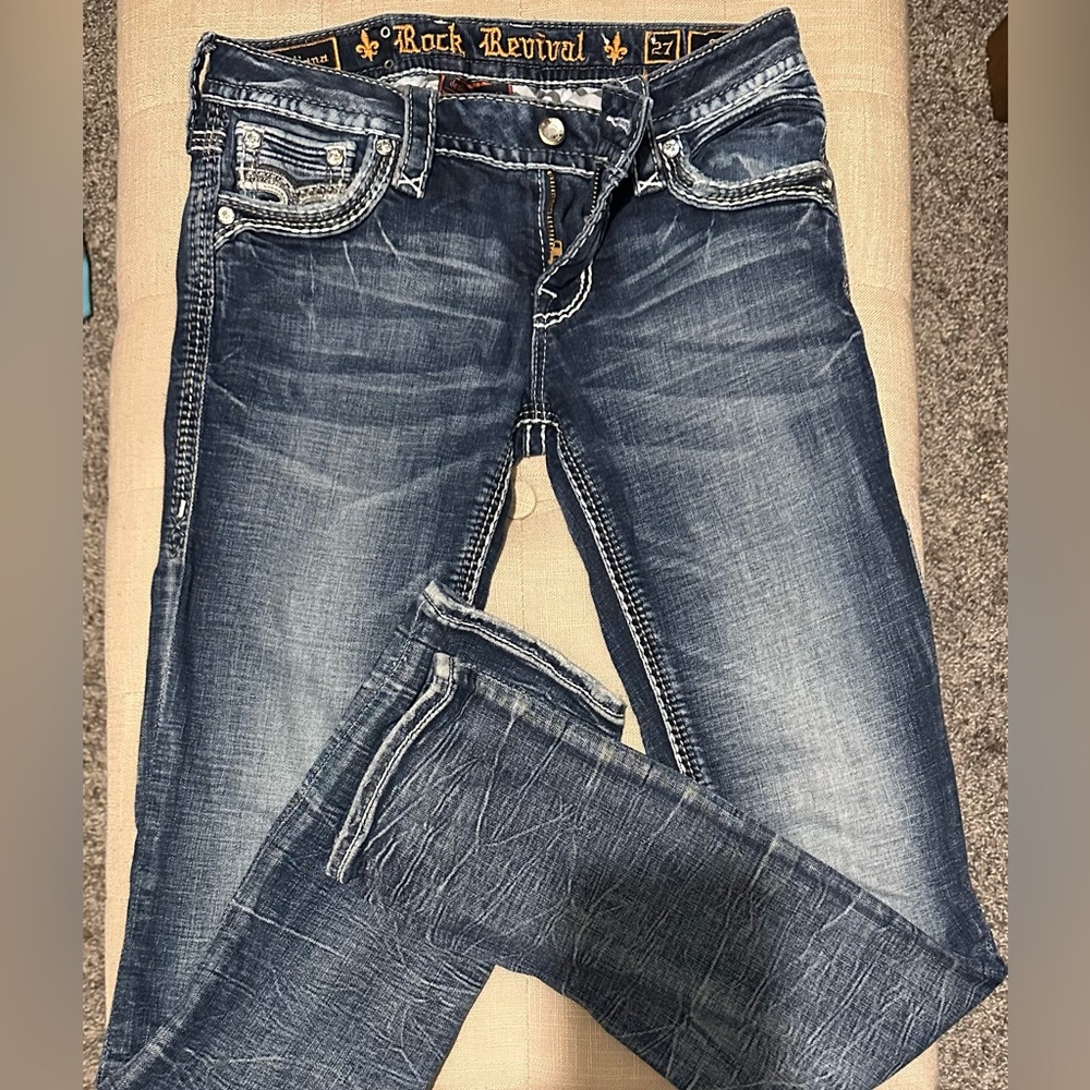 Rock Revival straight leg, stretchy, mid-rise jeans. Size 27